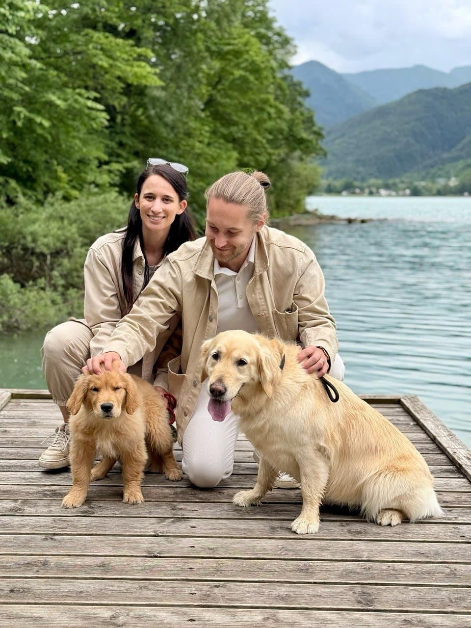 Cesare and Laura with Hera and Leo on a pier by the lake