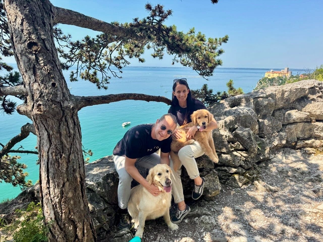 Cesare and Laura with Hera and Leo on the coast of Trieste